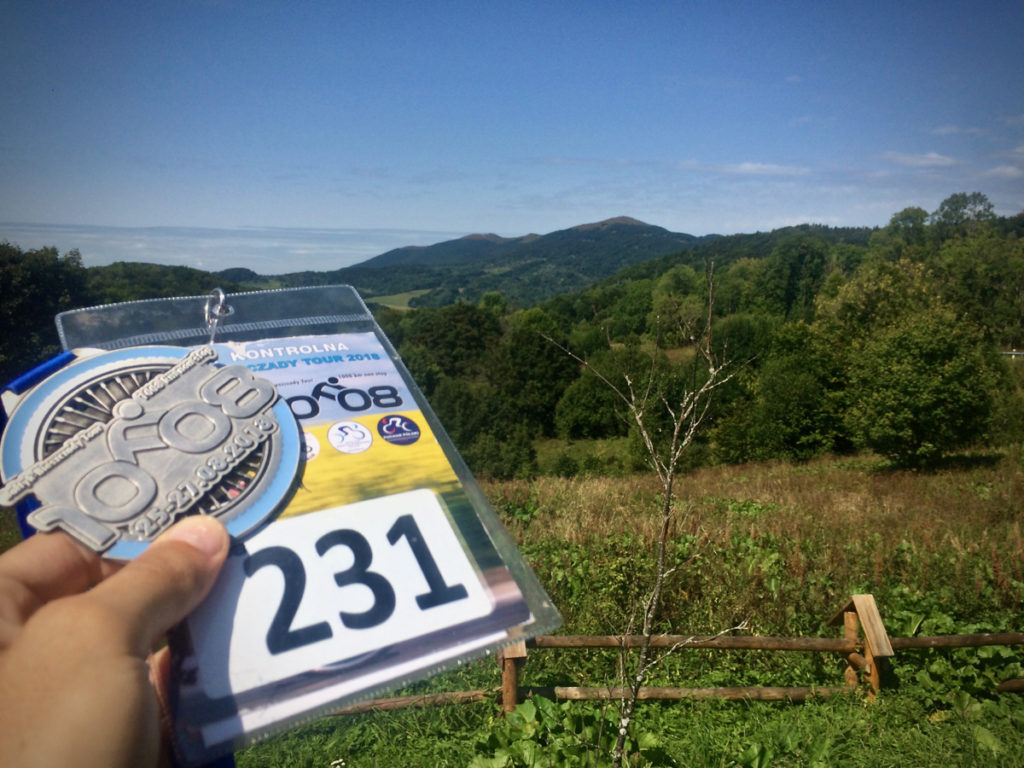 Karta kontrolna i medal po maratonie kolarskim